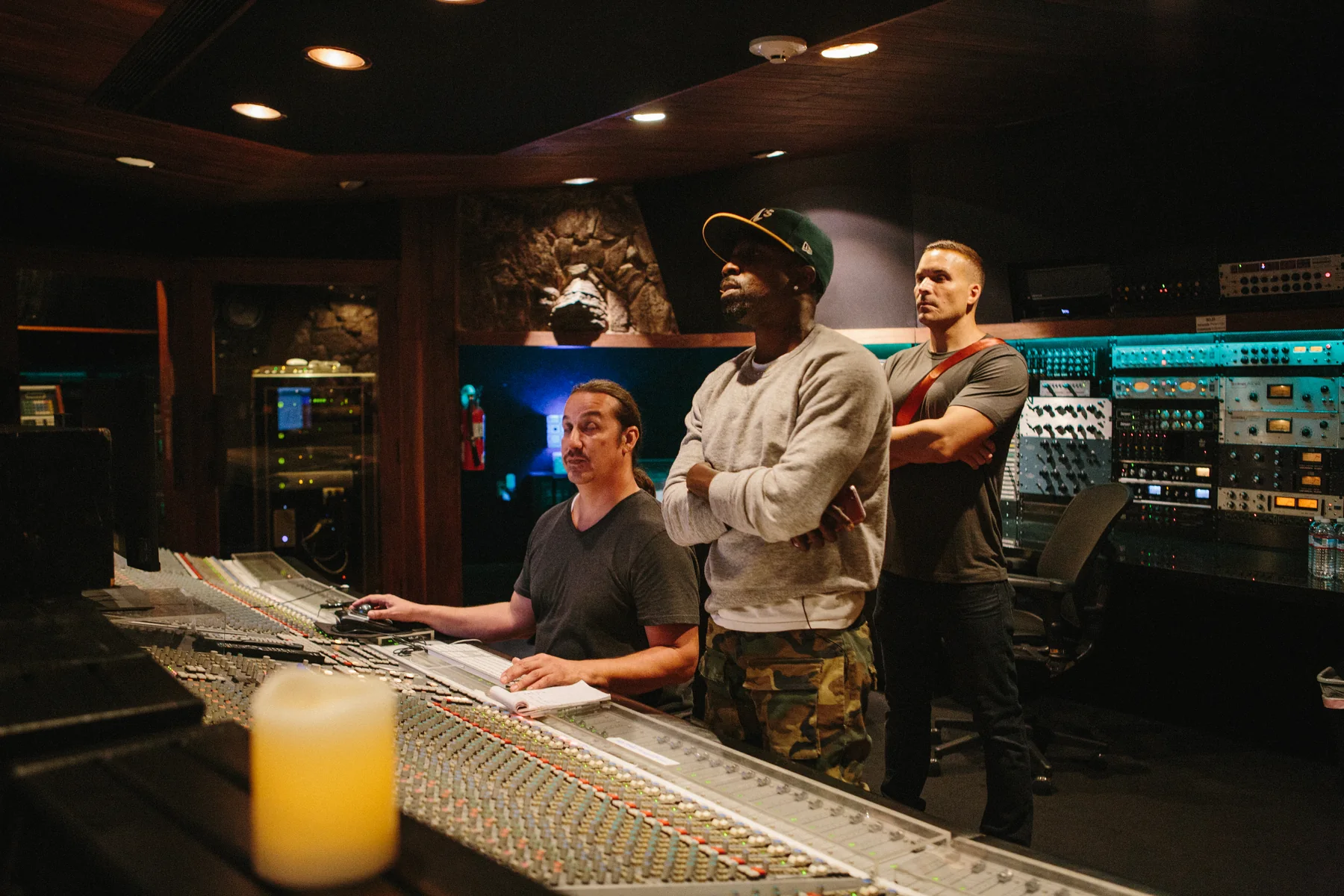 Artists collaborating in a recording room