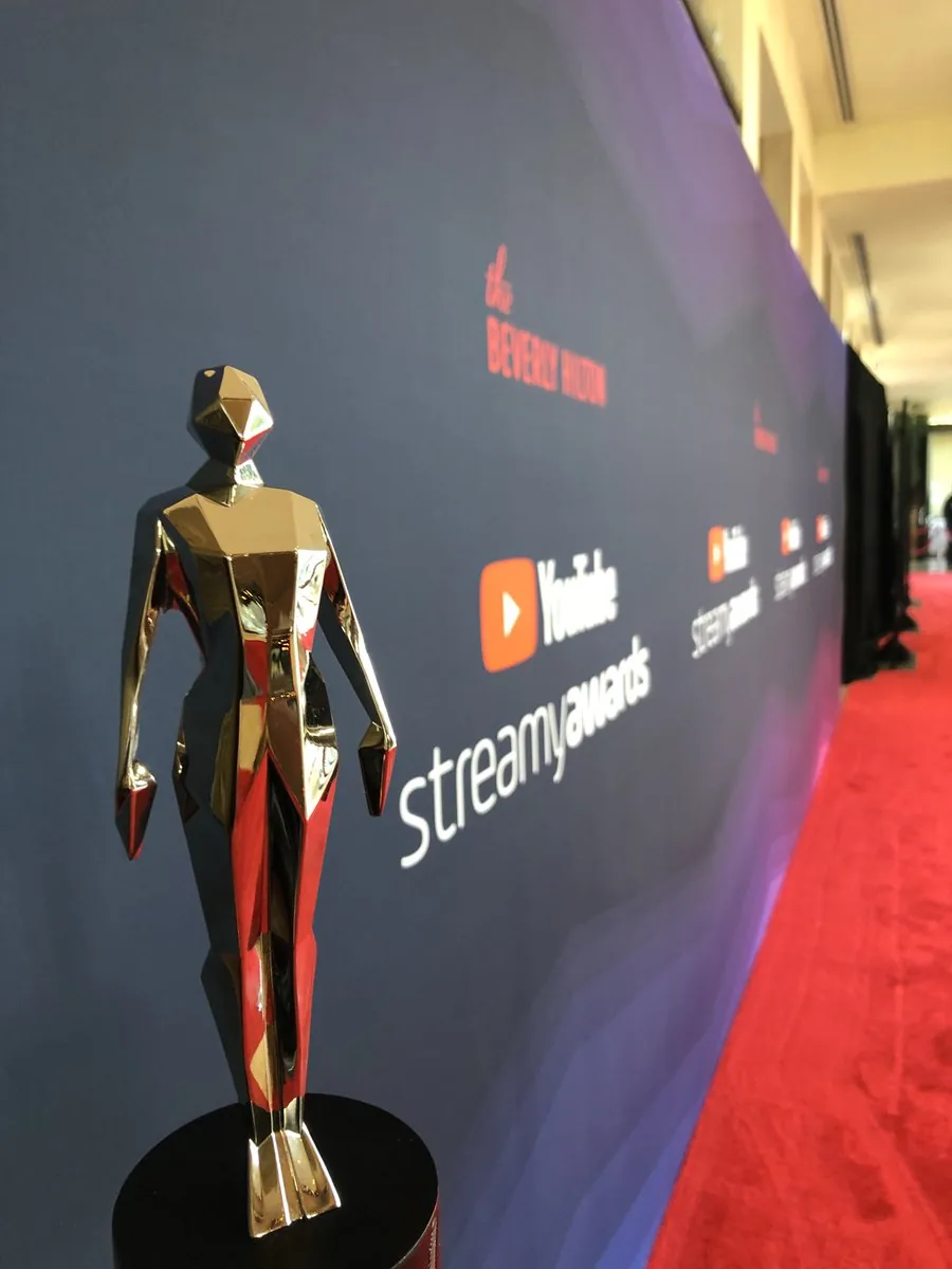Streamy Awards trophy and red carpet environment