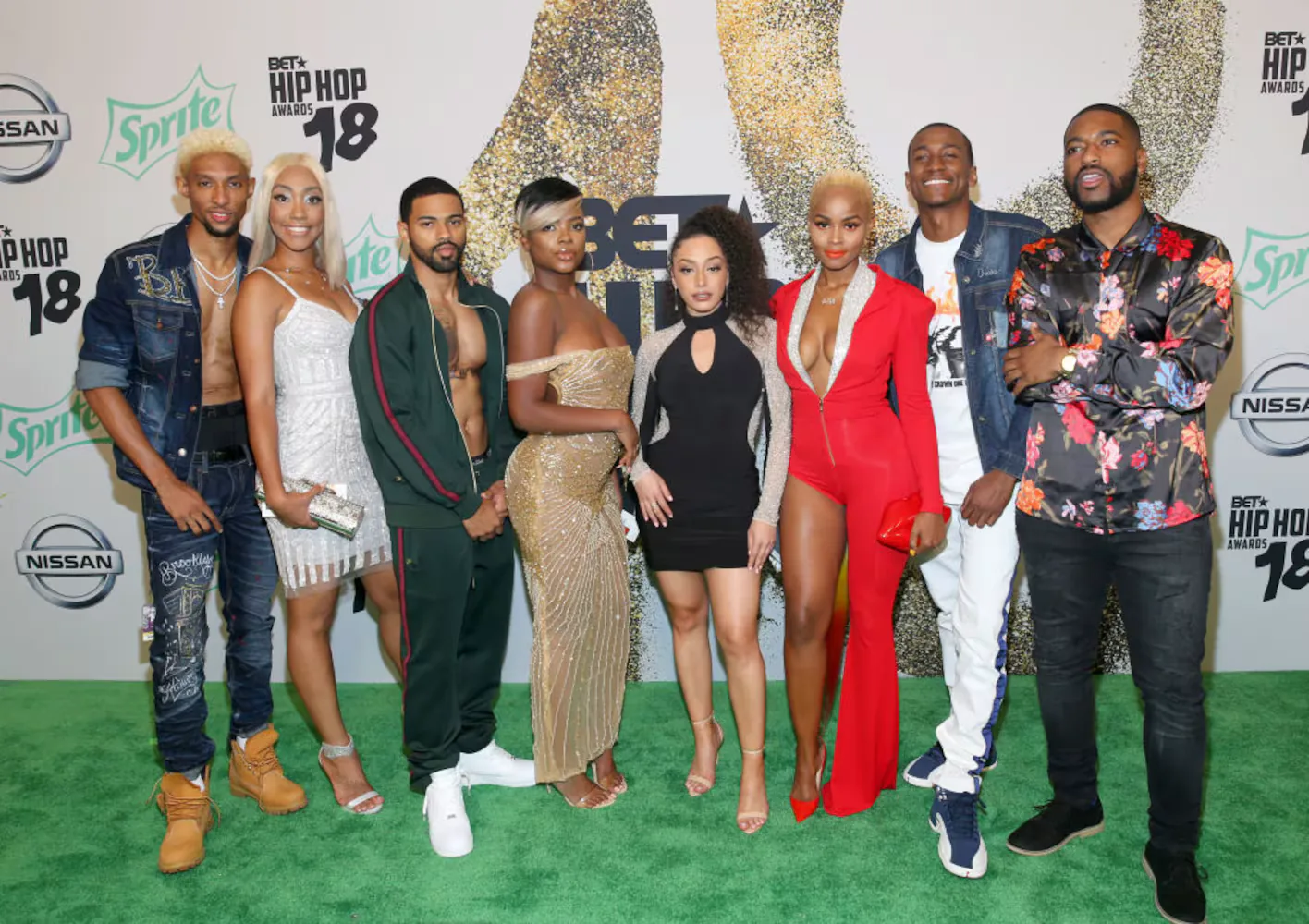 BET Hip Hop Awards guests in front of the event identity